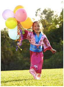 Screenshot from Disney Store of girl wearing Mulan costume in hot pink & blue, carrying balloons.